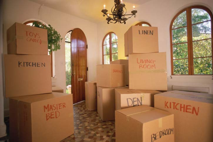 Moving boxes labeled with rooms