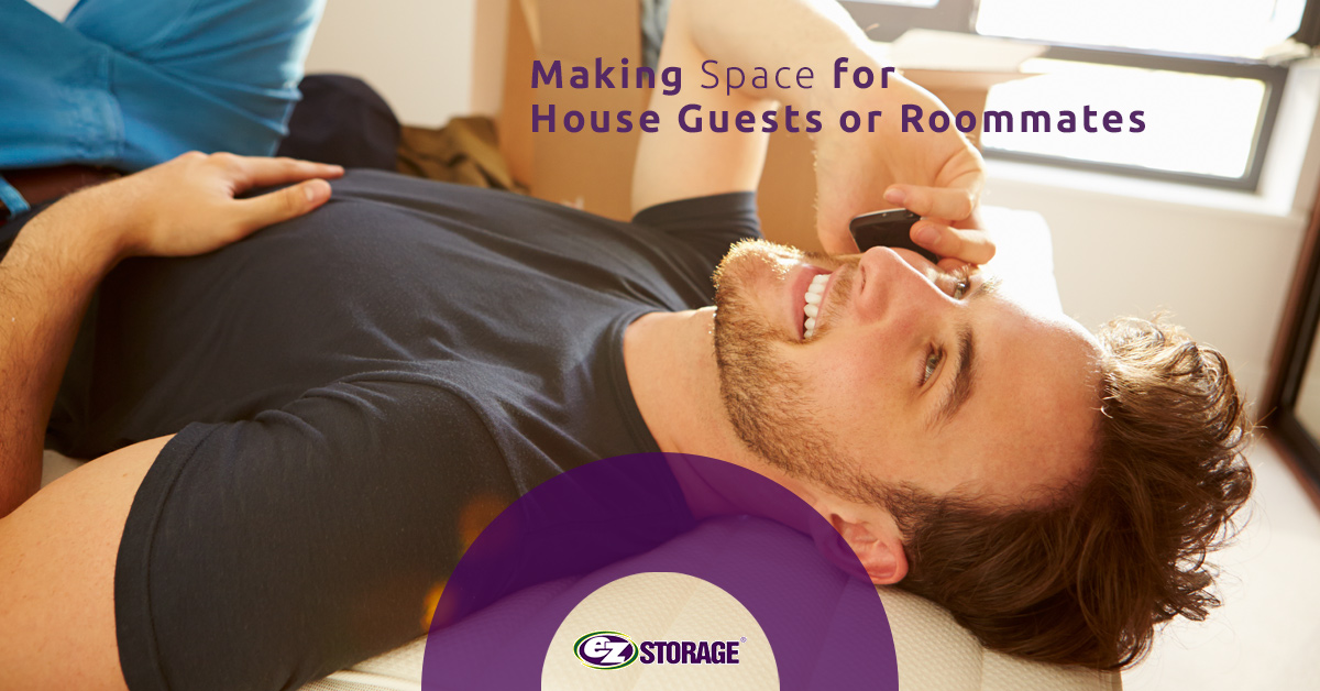 Man on his phone laying on a bed with text "Making Space for House Guests or Roommates"