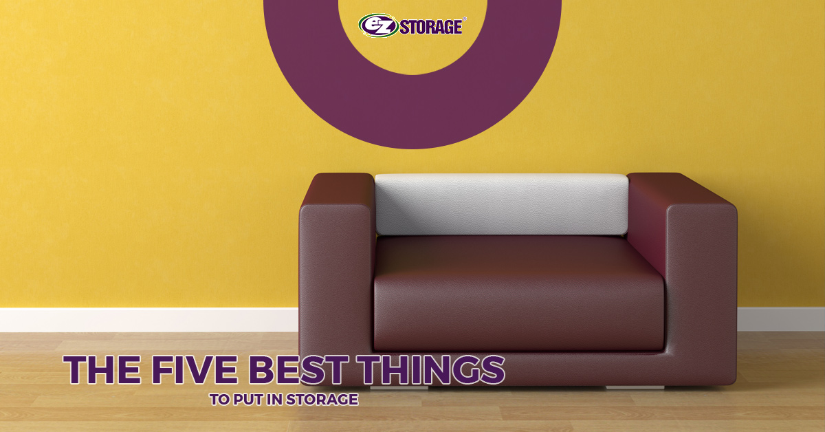 A brown and white loveseat in a yellow painted room