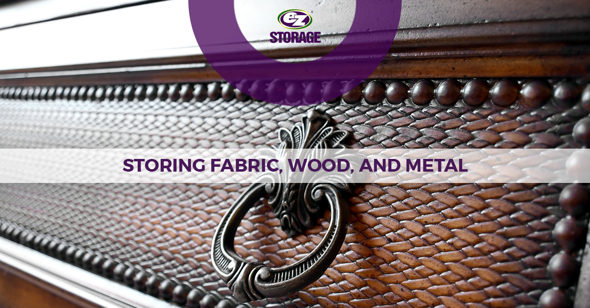 Close up of antique drawer of a cabinet with text "storing fabric, wood and metal"