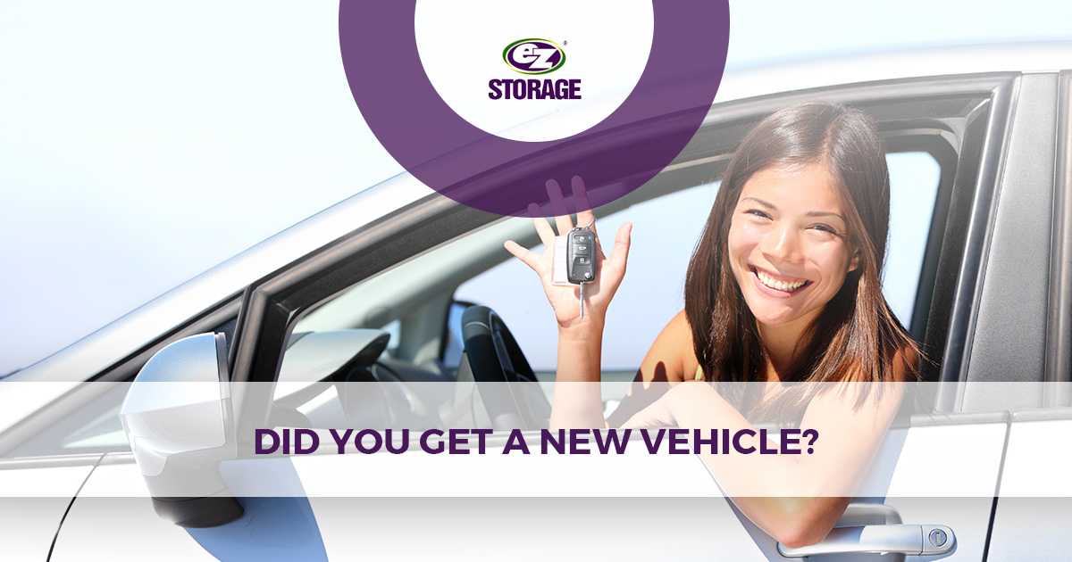 Woman inside her car holding keys with text "did you get a new vehicle?"