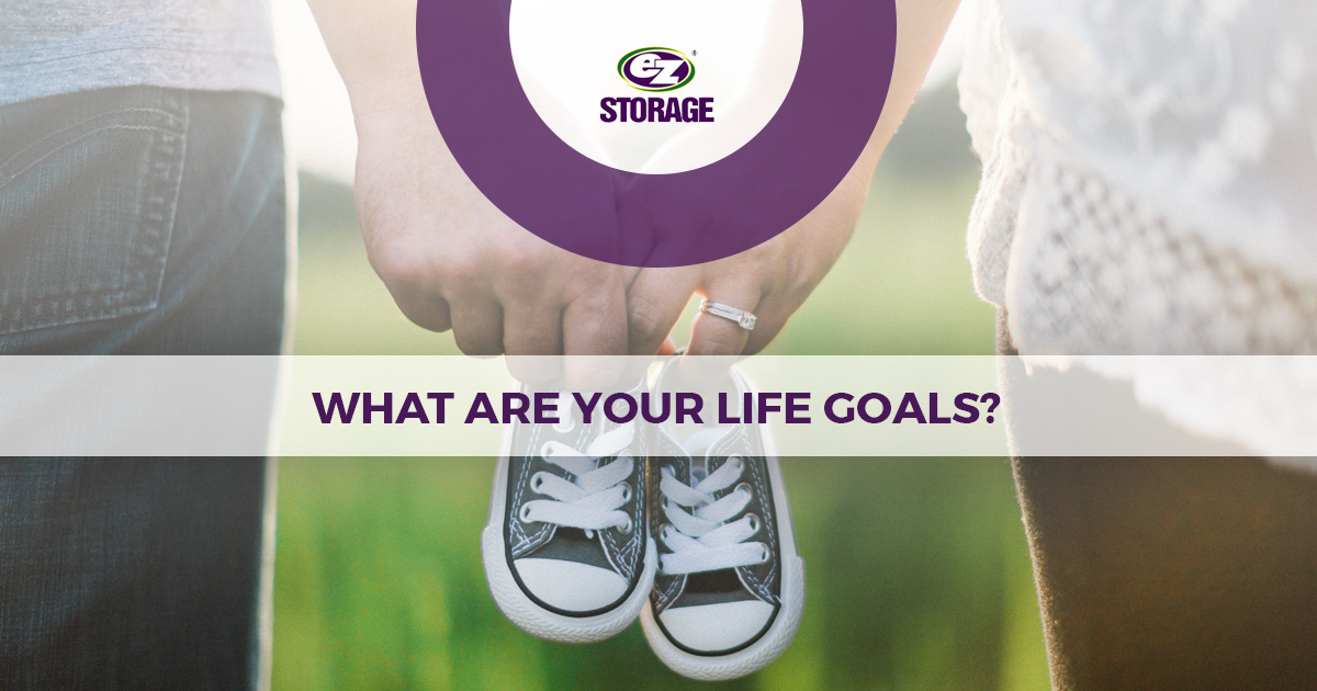 Hands of a married couple holding baby shoes and text "what are your life goals?"