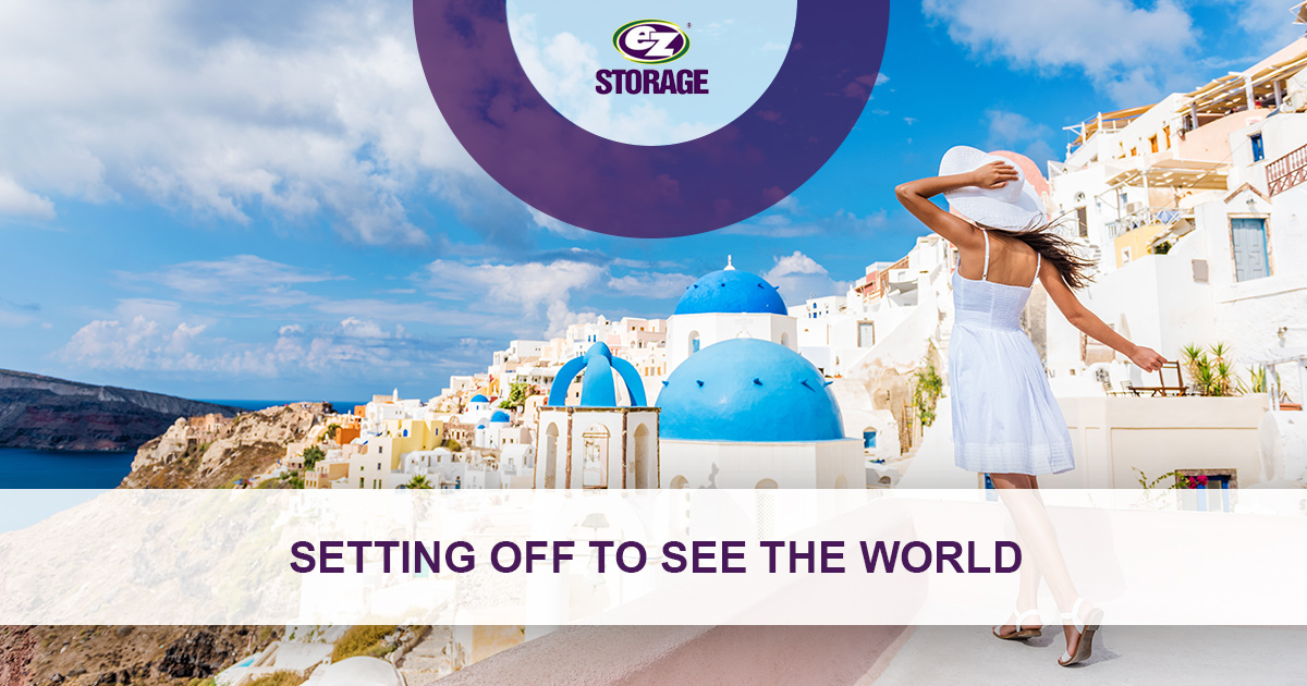 Women in summer outfit taking in the sights of Santorini and text text "Setting off to see the world"