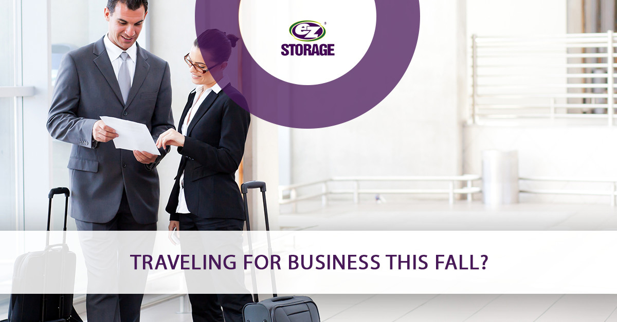 Business man and women traveling looking at a sheet of paper together and text "Traveling for business this fall?"