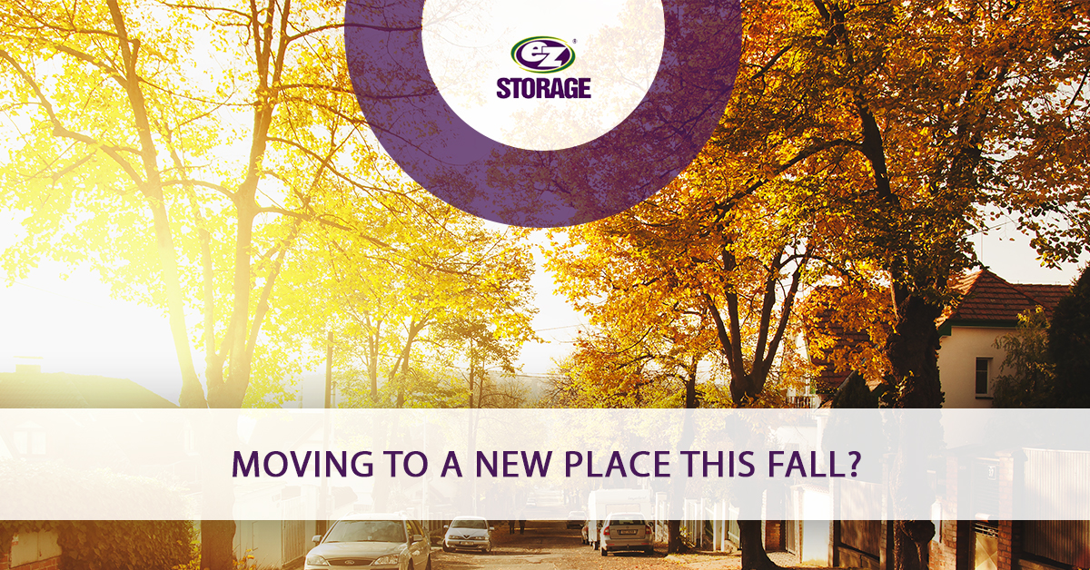 Neighborhood street lined with trees with sunshine with EZ Storage logo and text "Moving To A New Place This Fall?"