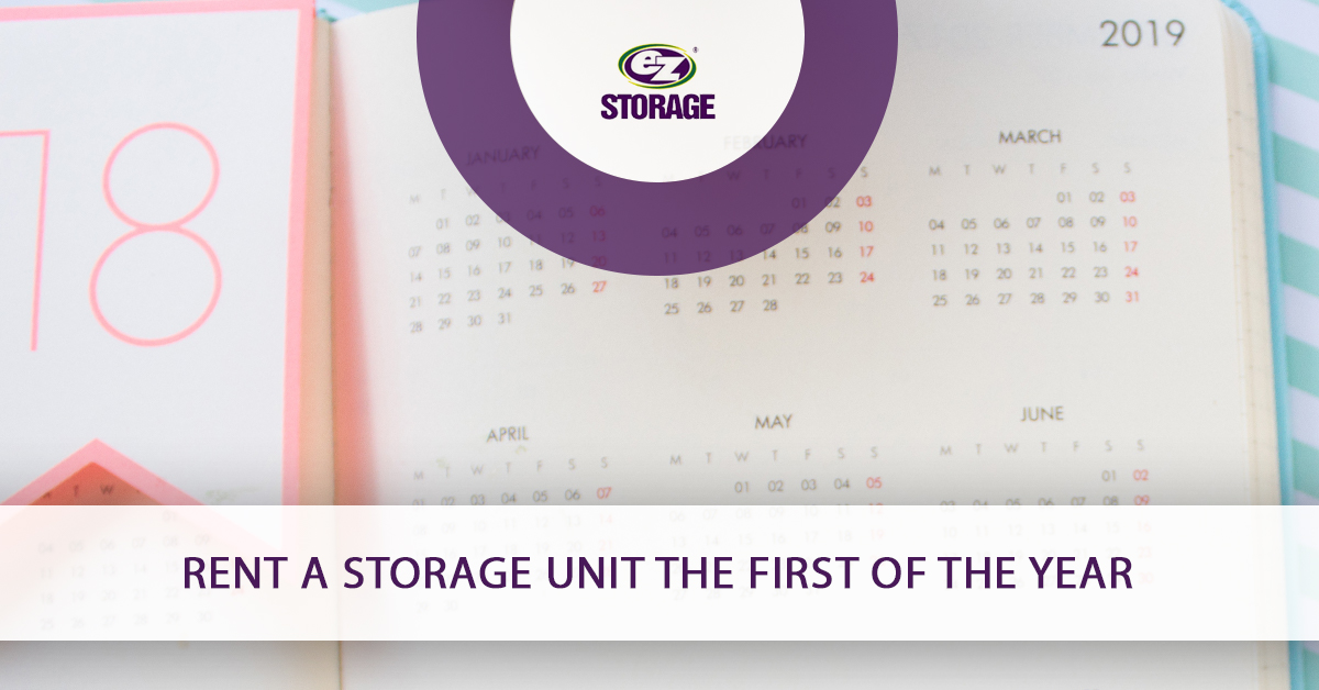 Notebook opened to a page with a calendar and text "Rent a storage unit the first of the year"