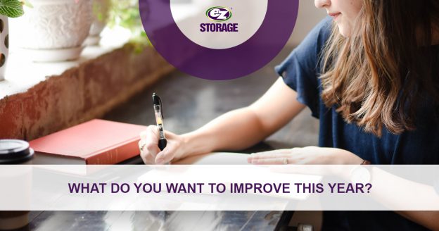 Women writing in a notebook at a desk and text "What do you want to improve this year?"