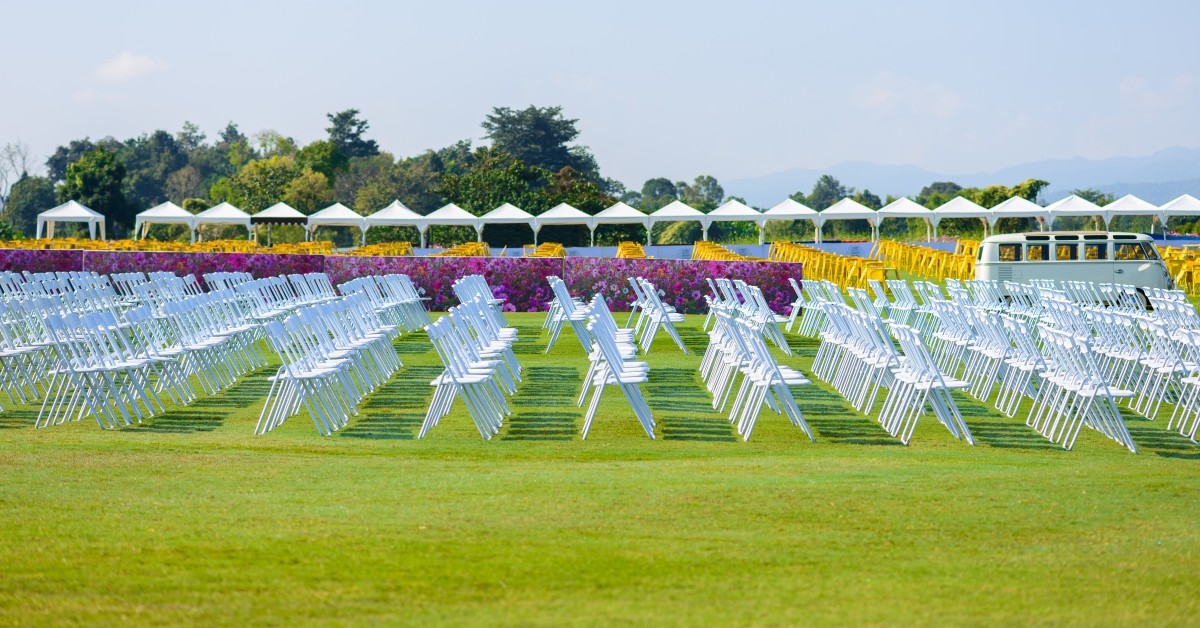 Several rows of chairs in an outside venue