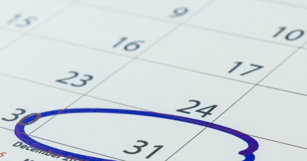 Close up of paper calendar with the 31st circled in blue ink.