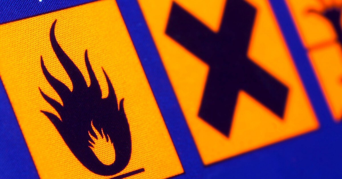 Close up of hazard label warnings including a flammable warning