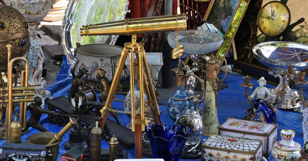 Various valuable items on a blue moving tarp